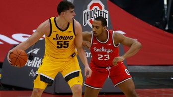 Garza, Weiskamp lead No. 9 Iowa over No. 4 Ohio State 73-57