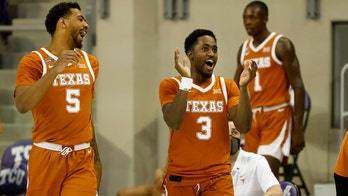 No. 15 Texas keeps road roll going with 76-64 win over TCU