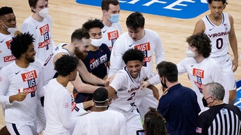 Virginia, defending NCAA men's basketball champs, out of ACC tournament over positive COVID-19 test