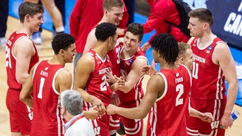 Wisconsin routs UNC, Williams falls to 29-1 in NCAA openers