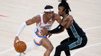 Thunder's Shai Gilgeous-Alexander gets support from teammate Lu Dort while getting COVID-19 vaccine