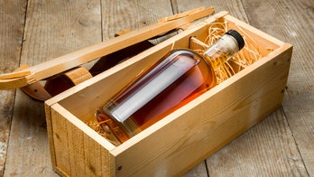 Contractor finds secret message, bottle of whisky from old homeowners beneath floor