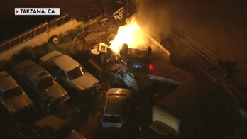 LA pursuit suspect drives off freeway, hits transformer and bursts into flames; suspect in custody