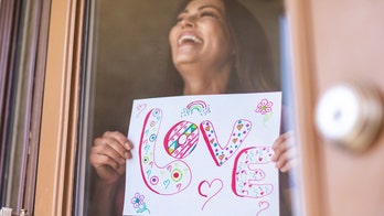 Woman flirts with neighbor with signs through window, TikTok begs to know what happens next