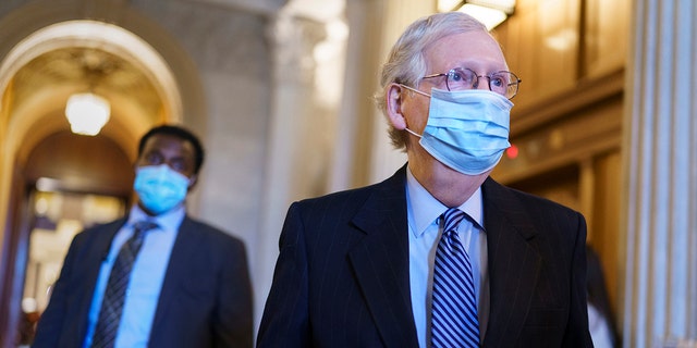 Senate Minority Leader Mitch McConnell, R-Ky., leaves the chamber after criticizing Democrats for wanting to change the filibuster rule, at the Capitol in Washington, Tuesday, March 16, 2021. (AP Photo/J. Scott Applewhite)