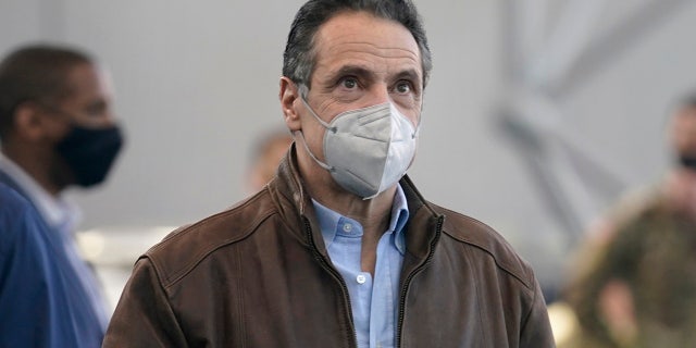 New York Gov. Andrew Cuomo arrives to speak at a large vaccination site on Monday, March 8, 2021, in New York. (AP Photo/Seth Wenig, Pool)