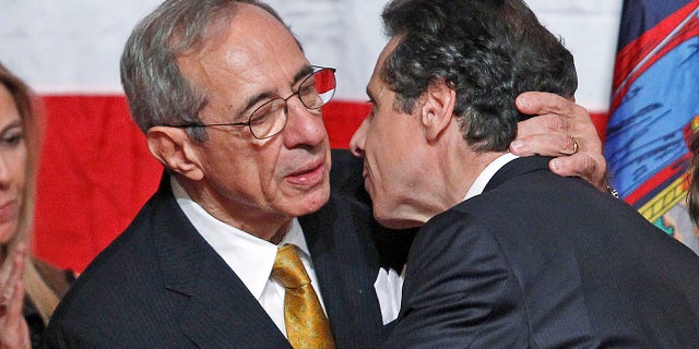 Democratic gubernatorial candidate Andrew Cuomo, right, hugs his father Mario after winning election for New York governor Nov. 2, 2010.