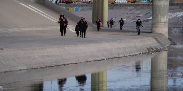 Migrants cross the border into El Paso March 17, 2021, as seen from Ciudad Juarez, Mexico. El Paso has seen a surge of migrants in September 2022, putting a strain on city resources and local nonprofits.