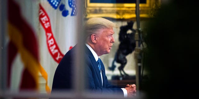 President Donald Trump addresses the nation from the Oval Office about the coronavirus outbreak at the White House, Wednesday, March 11, 2020, in Washington. (AP Photo/Manuel Balce Ceneta)
