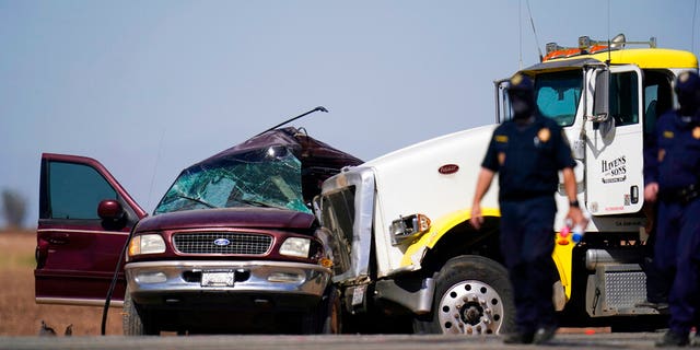 FILE: Lw enforcement officers work at the scene of a deadly crash in Holtville, Calif.