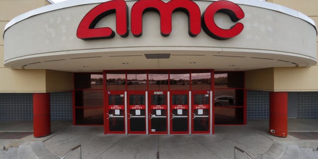 This May 8, 2020 photo shows an AMC Theatre is shown in Clinton Township, Mich. AMC Theatres says it will have 98% of its U.S. movie theaters open on Friday, March 19, 2021, with more expected to open by March 26. Shares of AMC Entertainment Holdings Inc. are up more than 4% before the market open on Thursday. (AP Photo/Paul Sancya)