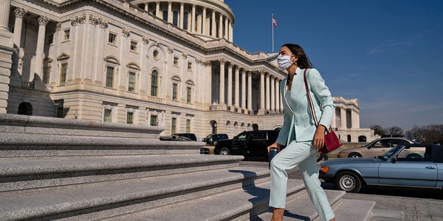 WASHINGTON, DC - MARCH 11: Rep. Alexandria Ocasio-Cortez (D-NY) walks up the steps to the House on Capitol Hill on Thursday, March 11, 2021 in Washington, DC. (Kent Nishimura / Los Angeles Times via Getty Images)