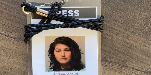 Andrea Sahouri, reporter for the Des Moines Register, has a peach sign from her jail discussion photo of her arrest on May 31, 2020 during a Black Lives Matter protest.  (Photo courtesy of Andrea Sahouri via AP)