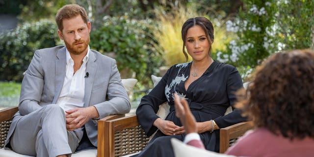 This image provided by Harpo Productions shows Prince Harry, left, and Meghan, Duchess of Sussex, in conversation with Oprah Winfrey. "Oprah with Meghan and Harry: A CBS Primetime Special" airing March 7, 2021. (Joe Pugliese / Harpo Productions via AP, FILE)