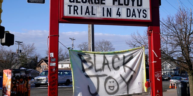A trial countdown sign marks the days at George Floyd Square, March 4, 2021, in Minneapolis. (AP Photo/Jim Mone)