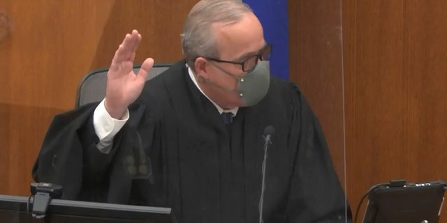 In this screengrab from video Hennepin County Judge Peter Cahill swears in a potential juror as he presides over jury selection in the trial of former Minneapolis police officer Derek Chauvin on March 9 at the Hennepin County Courthouse in Minneapolis. Chauvin is charged in the May 25, 2020 death of George Floyd. (Court TV, via AP, Pool)