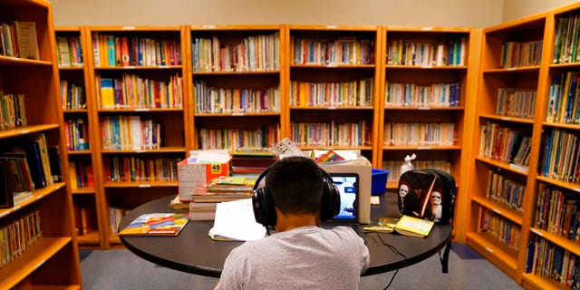 A Los Angeles Unified School District student attends an online class at the Boys &amp; Girls Club of Hollywood in Los Angeles. 