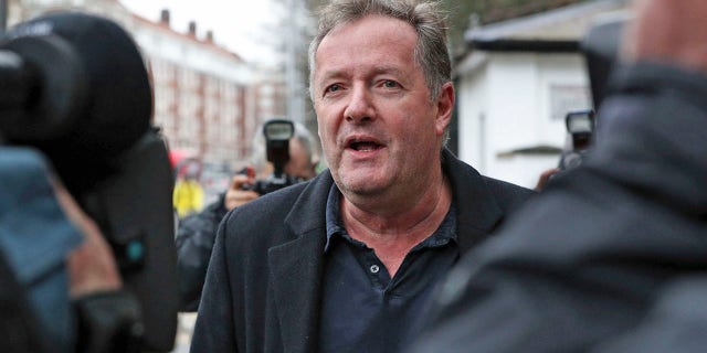 British television host Piers Morgan speaks to reporters outside his home in Kensington, central London, Wednesday March 10, 2021. Morgan quit the "Good Morning Britain" program on Tuesday after making controversial comments about the Duchess of Sussex. The U.K.’s media watchdog said earlier Tuesday it was launching an investigation into the show under its harm and offense rules after receiving more than 41,000 complaints about Morgan’s comments on Meghan. (Jonathan Brady/PA via AP)