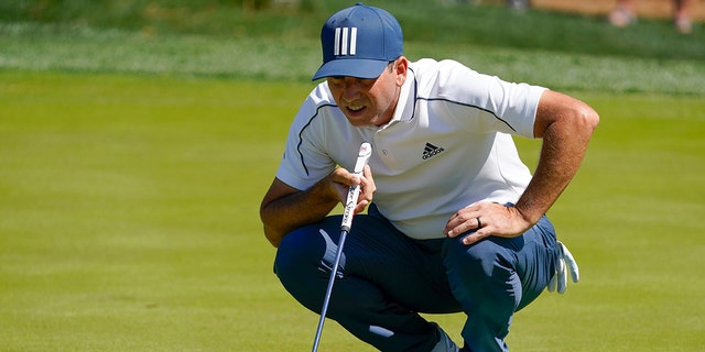 Sergio Garcia, of Spain, lines up a putt on the fifth hole during the first round of the The Players Championship golf tournament Thursday, March 11, 2021, in Ponte Vedra Beach, Fla. 