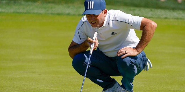 Sergio Garcia, of Spain, lines up a putt on the fifth hole during the first round of the The Players Championship golf tournament Thursday, March 11, 2021, in Ponte Vedra Beach, Fla.
