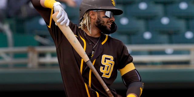 San Diego Padres' Fernando Tatis Jr. stretches in the batter's box during the first inning of a spring training baseball game against the Oakland Athletics, Friday, March 12, 2021, in Mesa, Ariz. (AP Photo/Matt York)