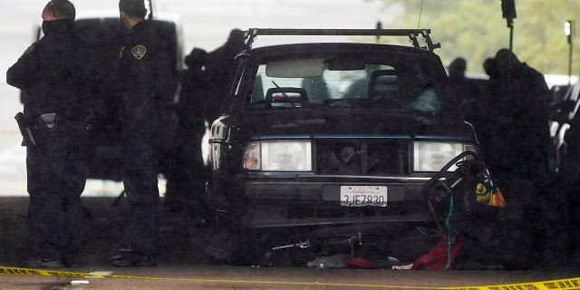 A car involved in a deadly accident sits at the scene Monday, March 15, 2021, in San Diego. A driver plowed through a crowd on a sidewalk in downtown San Diego on Monday morning, killing three people and injuring six others, including two who are hospitalized in critical condition, police said. (AP Photo/Gregory Bull)