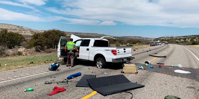 Debris is strewn across a road near the border city of Del Rio, Texas after a collision Monday, March 15, 2021. (Texas Department of Public Safety via AP)
