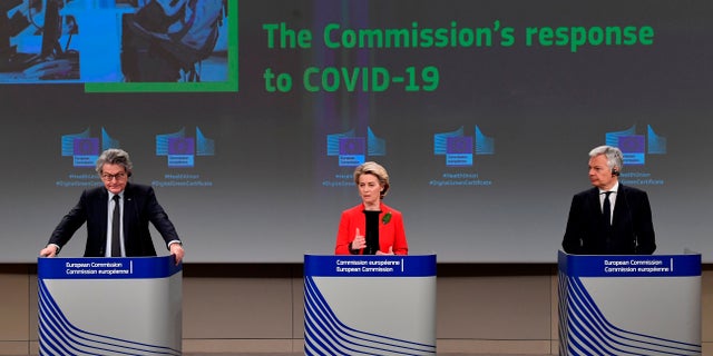 European Commission President Ursula von der Leyen, center, European Commissioner for Internal Market Thierry Breton, left, and European Commissioner for Justice Didier Reynders participate in a media conference on the Commissions response to the coronavirus on March 17, 2021. (John Thys, Pool via AP)