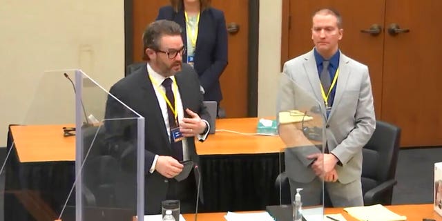 In this screen grab from video, defense attorney Eric Nelson, left, defendant and former Minneapolis police officer Derek Chauvin, right, and Nelson's assistant Amy Voss, back, introduce themselves to jurors as Hennepin County Judge Peter Cahill presides over jury selection in the trial of Chauvin Wednesday, March 17, 2021 at the Hennepin County Courthouse in Minneapolis, Minn. Chauvin is charged in the May 25, 2020 death of George Floyd. (Court TV, via AP, Pool)