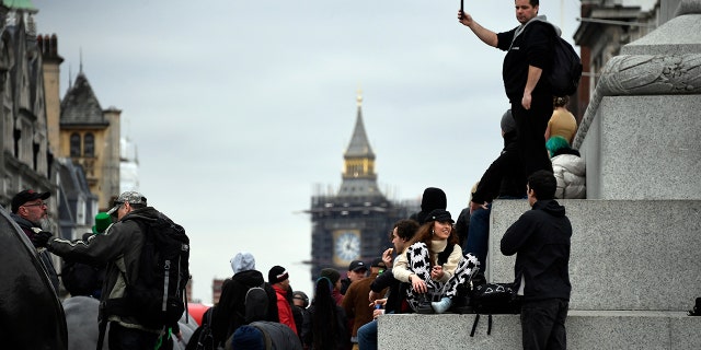 People without face masks attend a protest against government restrictions to curb the spread of the coronavirus in London on March 20, 2021. (AP Photo/Alberto Pezzali)