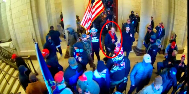 Ethan Seitz, 31, of Bucyrus, Ohio, outlined in red by the source, joins other rioters who stormed the U.S. Capitol on Jan. 6, 2021, in Washington.