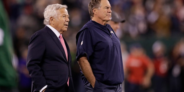 New England Patriots owner Robert Kraft, left, talks to head coach Bill Belichick as their team warms up before an NFL football game against the New York Jets in East Rutherford, N.J., in this Oct. 21, 2019, file photo.