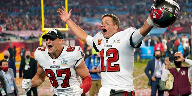 FILE - In this Sunday, Feb. 7, 2021 file photo, Tampa Bay Buccaneers tight end Rob Gronkowski, #87, and Tampa Bay Buccaneers quarterback Tom Brady, #12, celebrate together after the NFL Super Bowl LV football game against the Kansas City Chiefs in Tampa, Florida.