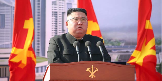 North Korean leader Kim Jong Un speaks during a ceremony to pave the way for the construction of 10,000 homes in Pyongyang, North Korea on Tuesday, March 23, 2021. 