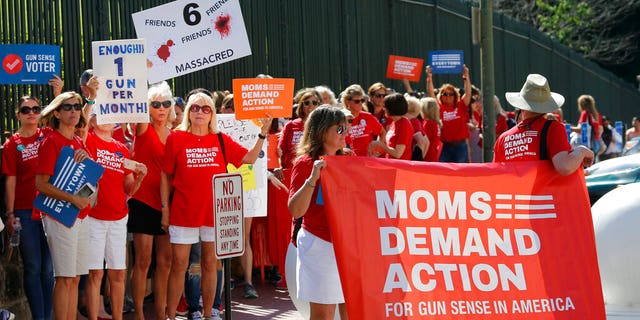 Moms Demanding Action line up during a rally at the State Capitol in Richmond, Virginia. 