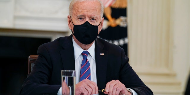 President Joe Biden meets with Vice President Kamala Harris, Health and Human Services Secretary Xavier Becerra and Homeland Security Secretary Alejandro Mayorkas in the State Dining Room of the White House, Wednesday, March 24, 2021, in Washington. (AP Photo/Evan Vucci)