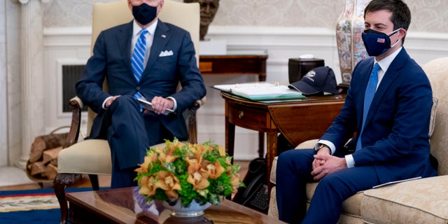 President Biden meets with Transportation Secretary Pete Buttigieg at the White House on March 4, 2021.