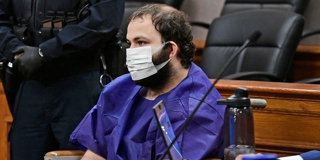 Ahmad Al Aliwi Alissa, 21, appears before Boulder District Court Judge Thomas Mulvahill at the Boulder County Justice Center in Boulder, Colo. on March 25, 2021. Three days after he was led away in handcuffs from a Boulder supermarket where 10 people were fatally shot, Alissa appeared in court for the first time and his defense lawyer asked for a mental health assessment "to address his mental illness." (Helen H. Richardson/The Denver Post via AP, Pool)