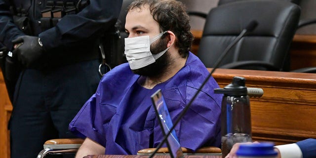 Ahmad Al Aliwi Alissa, 21, appears before Boulder District Court Judge Thomas Mulvahill at the Boulder County Justice Center in Boulder, Colo. on March 25, 2021. Three days after he was led away in handcuffs from a Boulder supermarket where 10 people were fatally shot, Alissa appeared in court for the first time and his defense lawyer asked for a mental health assessment "to address his mental illness." (Helen H. Richardson/The Denver Post via AP, Pool)