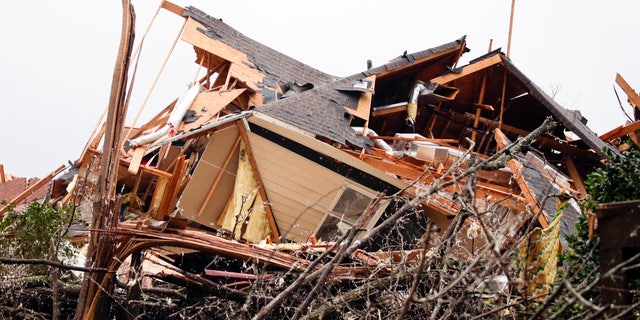 A house is totally destroyed after a tornado touches down south of Birmingham, Ala. in the Eagle Point community damaging multiple homes, Thursday, March 25, 2021.