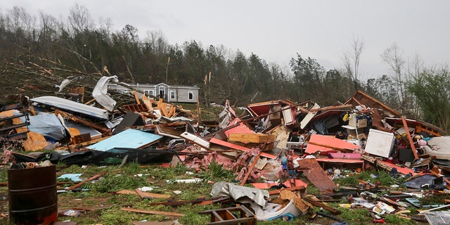 Piles of debris remain after a tornado touched down killing several people and damaging multiple homes Thursday, March 25, 2021 in Ohatchee, Ala. (Associated Press)