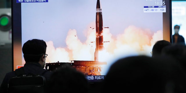 People watch a TV showing an image of North Korea's new guided missile during a news program at the Suseo Railway Station in Seoul, South Korea, Friday. March 26, 2021. In resuming its ballistic testing activity after a yearlong pause, North Korea has demonstrated a potentially nuclear-capable weapon that shows how it continues to expand its military capabilities amid a stalemate in diplomacy with the United States. (AP Photo/Ahn Young-joon)