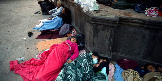 Migrants sleep under a gazebo at a park in the Mexican border city of Reynosa, Saturday, March 27, 2021.