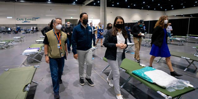 San Diego Mayor Todd Gloria and other officials are among the group of elected officials who were given a visit to the centre's temporary youth shelter on Saturday, March 27, 2021 in San Diego.  The girls will be separated into sleeping areas which will accommodate up to 50 girls per pod.  The temporary shelter will reach a maximum of around 1,450 girls.  (Nelvin C. Cepeda / The San Diego Union-Tribune via AP)