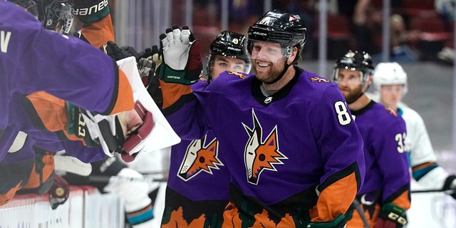 Arizona Coyotes right wing Phil Kessel (81) celebrates with teammates after scoring his third goal of the night against the San Jose Sharks March 27, 2021, in Glendale, Ariz.