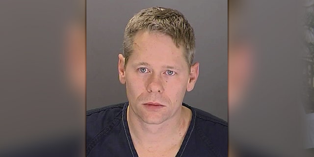 The booking photo from Bane's 2011 domestic violence arrest.
