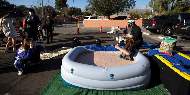 Barker sat in the tub of bean dip in front of Los Toros for 24 hours on Monday to raise awareness for the restaurant as it struggles during the coronavirus pandemic.