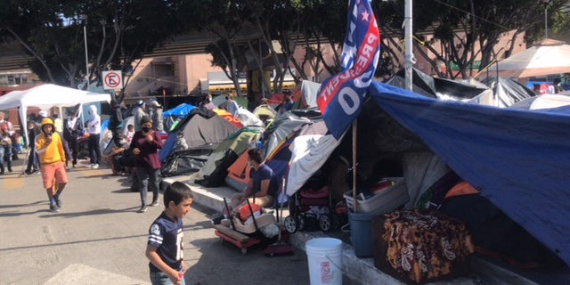 A Joe Biden campaign flag flies at a migrant camp near the U.S southern border. Republicans blame Biden's campaign rhetoric and policies for fueling the surge at the border. (Griff Jenkins/Fox News)