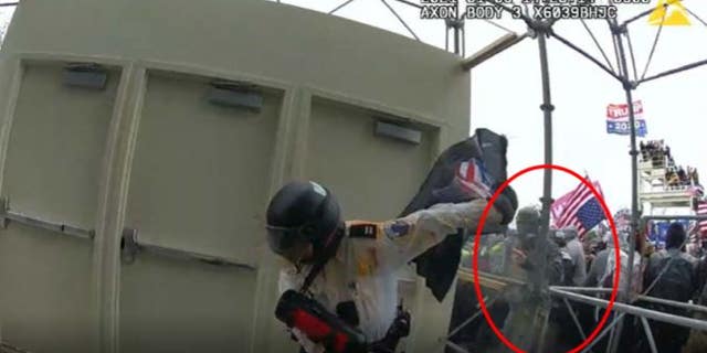 The image shows McKellop assaulting an officer with a flagpole, the FBI said.