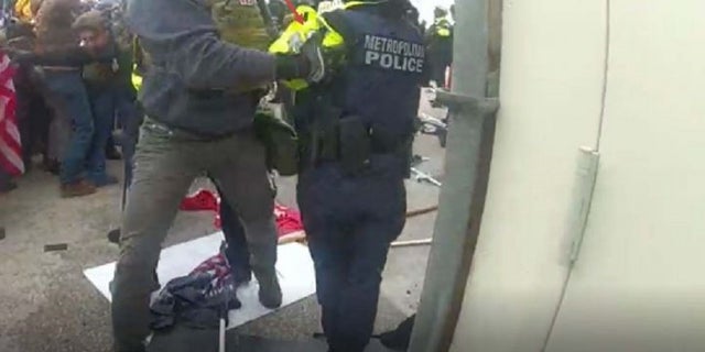 The FBI said Jeffrey McKellop grabbed a police officer's arm during the Jan. 6 siege on the Capitol in Washington D.C.